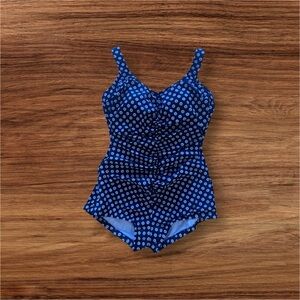 black one-piece retro-style bathing suit with white and gray polka dots.